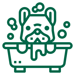 Pet grooming and bathing in a bathtub with soap bubbles.